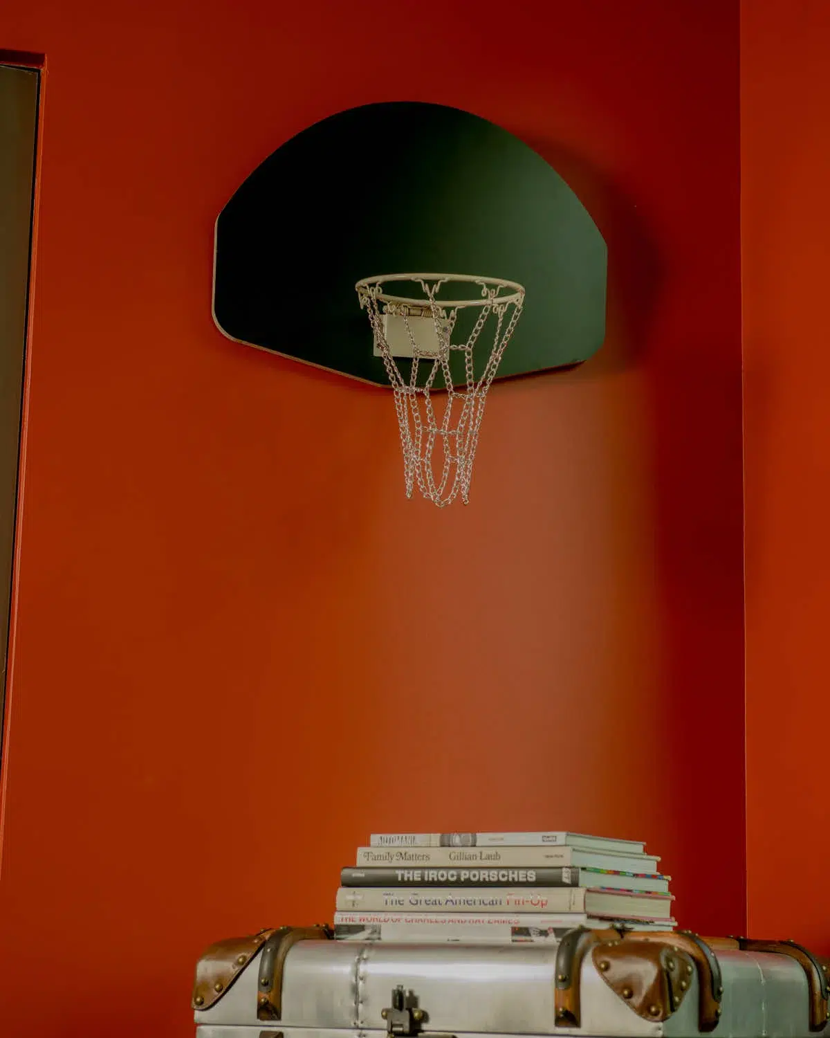 A Wooden Hoop Green in a room.