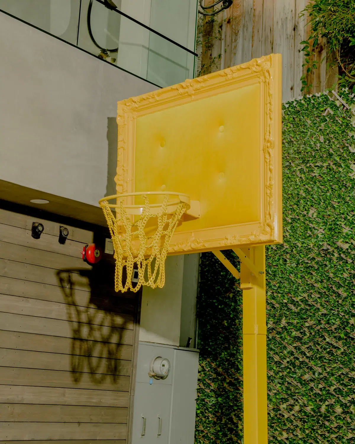 A vibrant yellow velvet hoop adorns the exterior of this house.