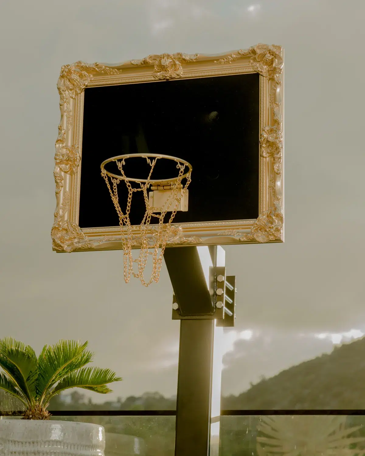 A rooftop installation featuring a black velvet hoop in a frame.