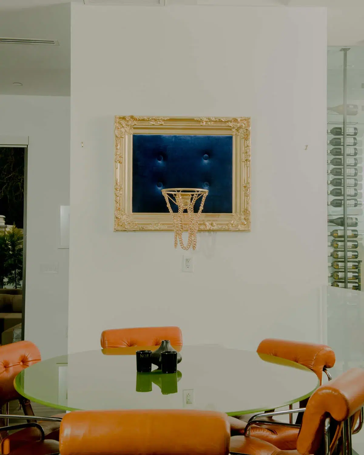 A living room featuring a captivating Blue Velvet Hoop as wall decor.