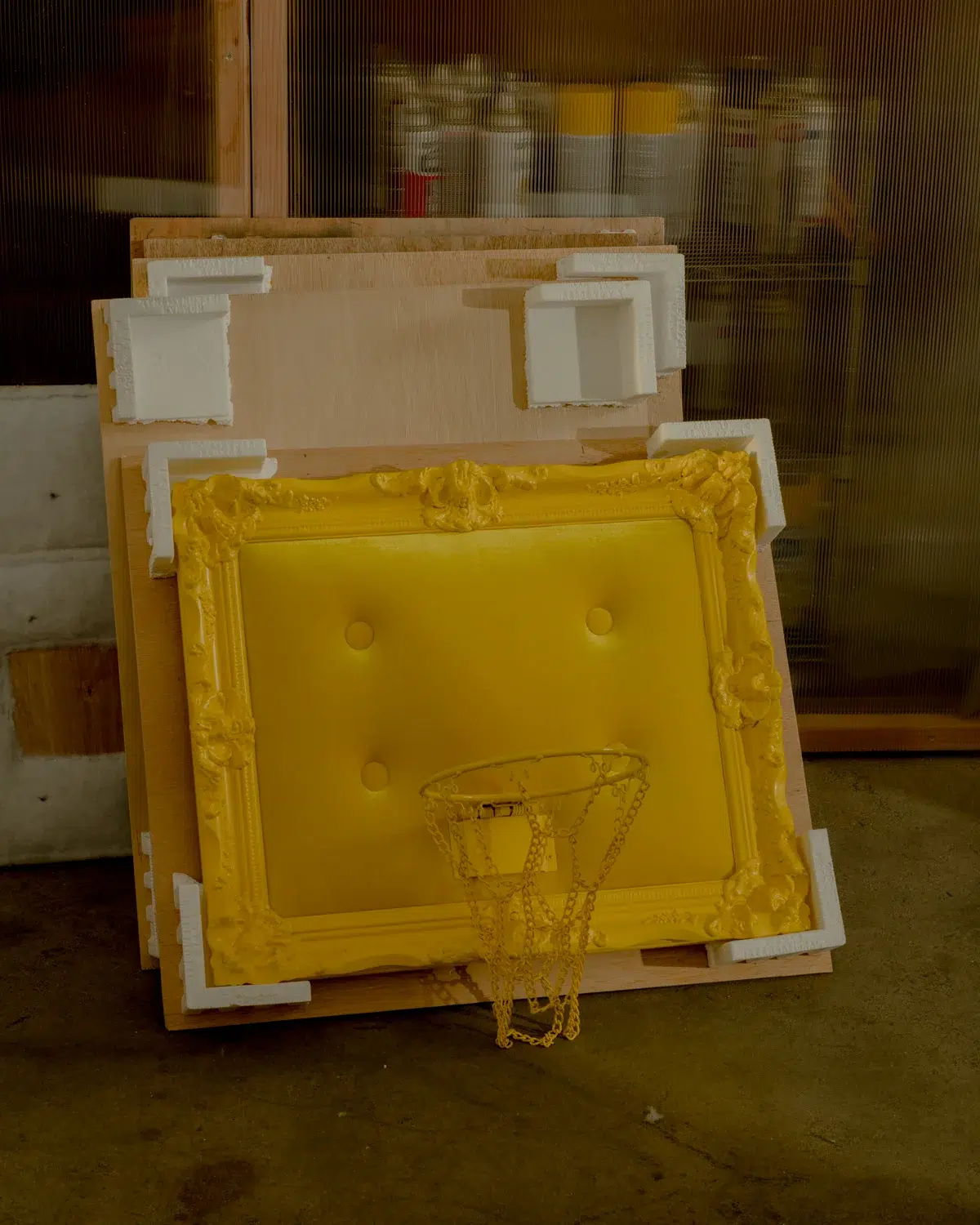 A yellow velvet hoop presented in a box.