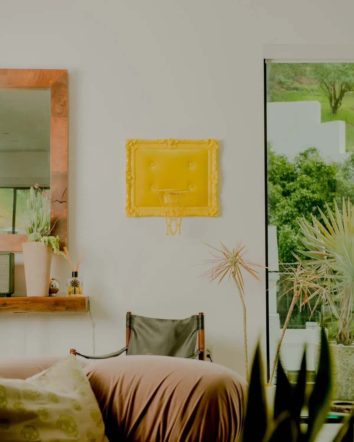 A living room with a Yellow Velvet Hoop used as decor.