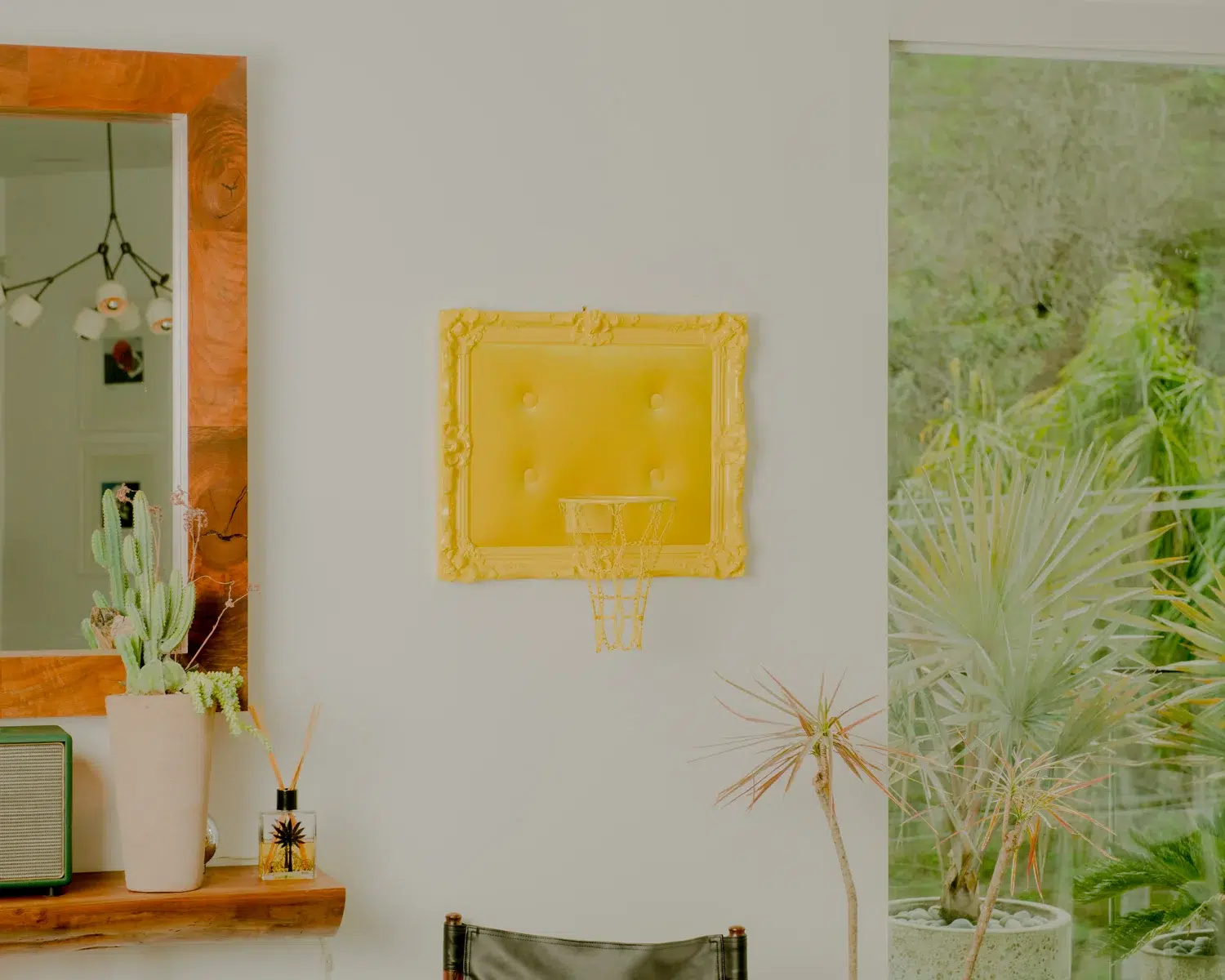 A room adorned with a vibrant Yellow Velvet Hoop as a wall decoration.