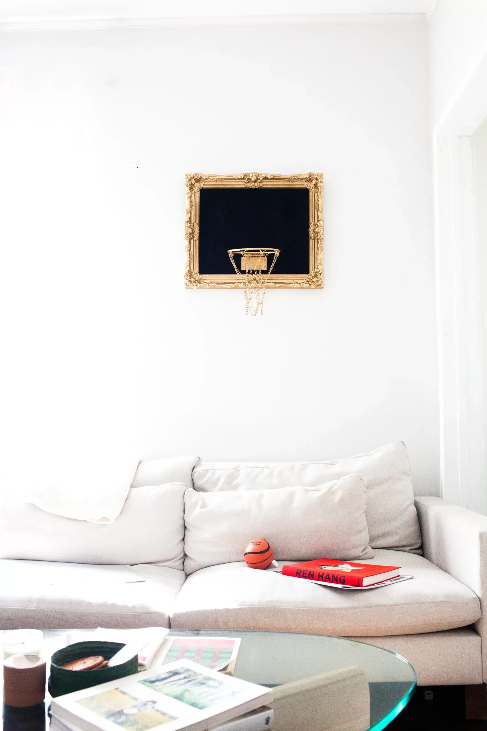 A living room featuring a striking Black Velvet Hoop as wall decor.