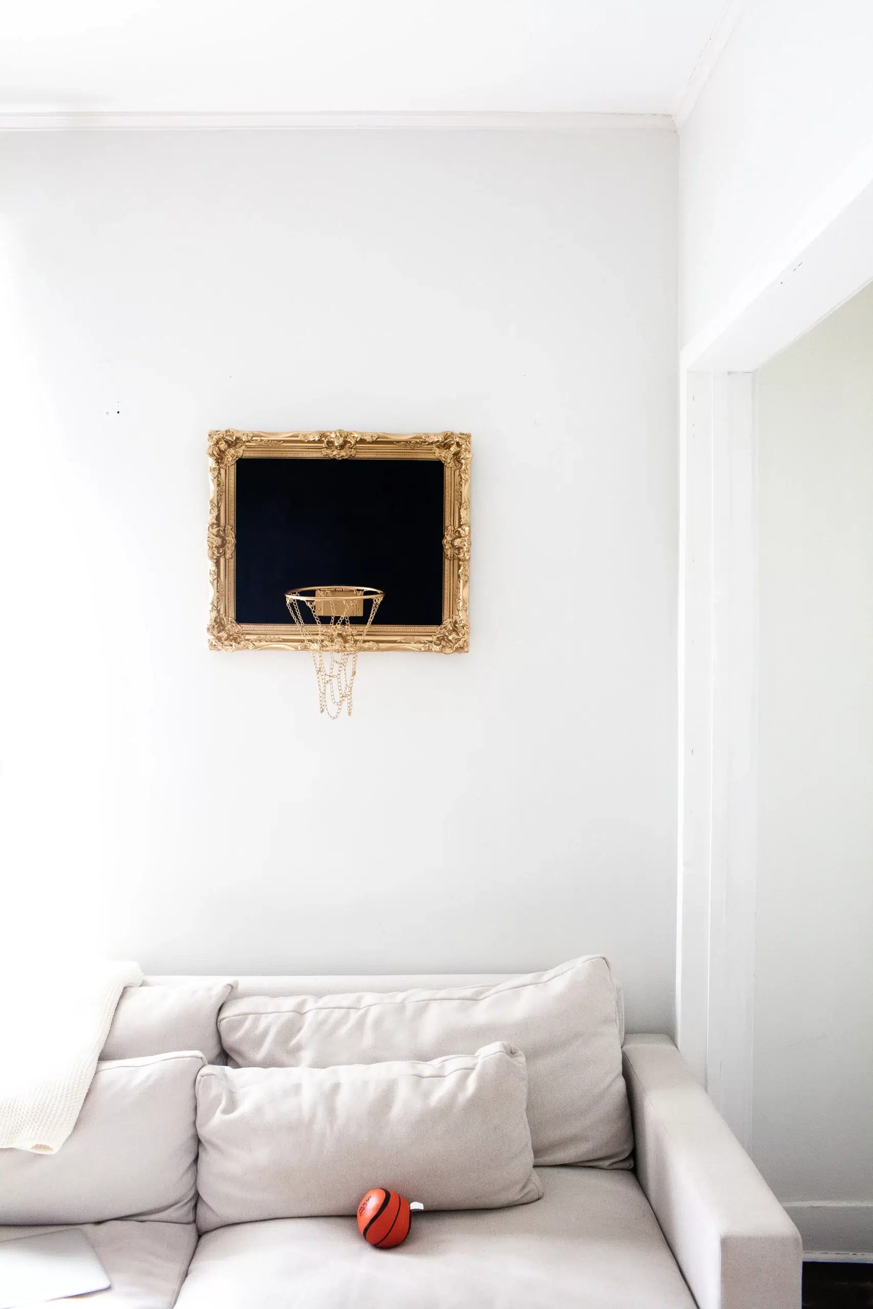 A living room featuring a striking Black Velvet Hoop wall decor.
