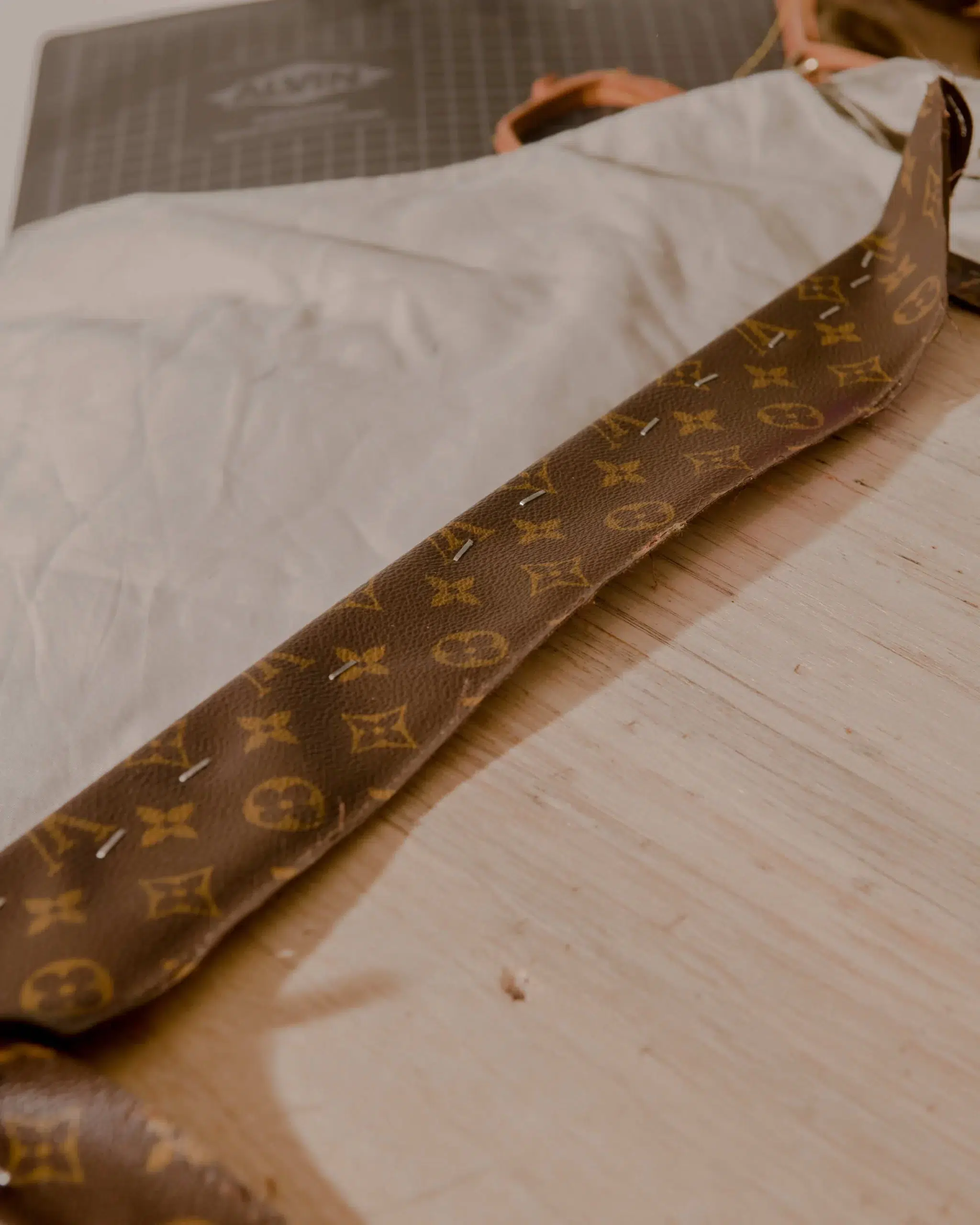 A designer Hoop bag by Louis Vuitton elegantly placed on a table.