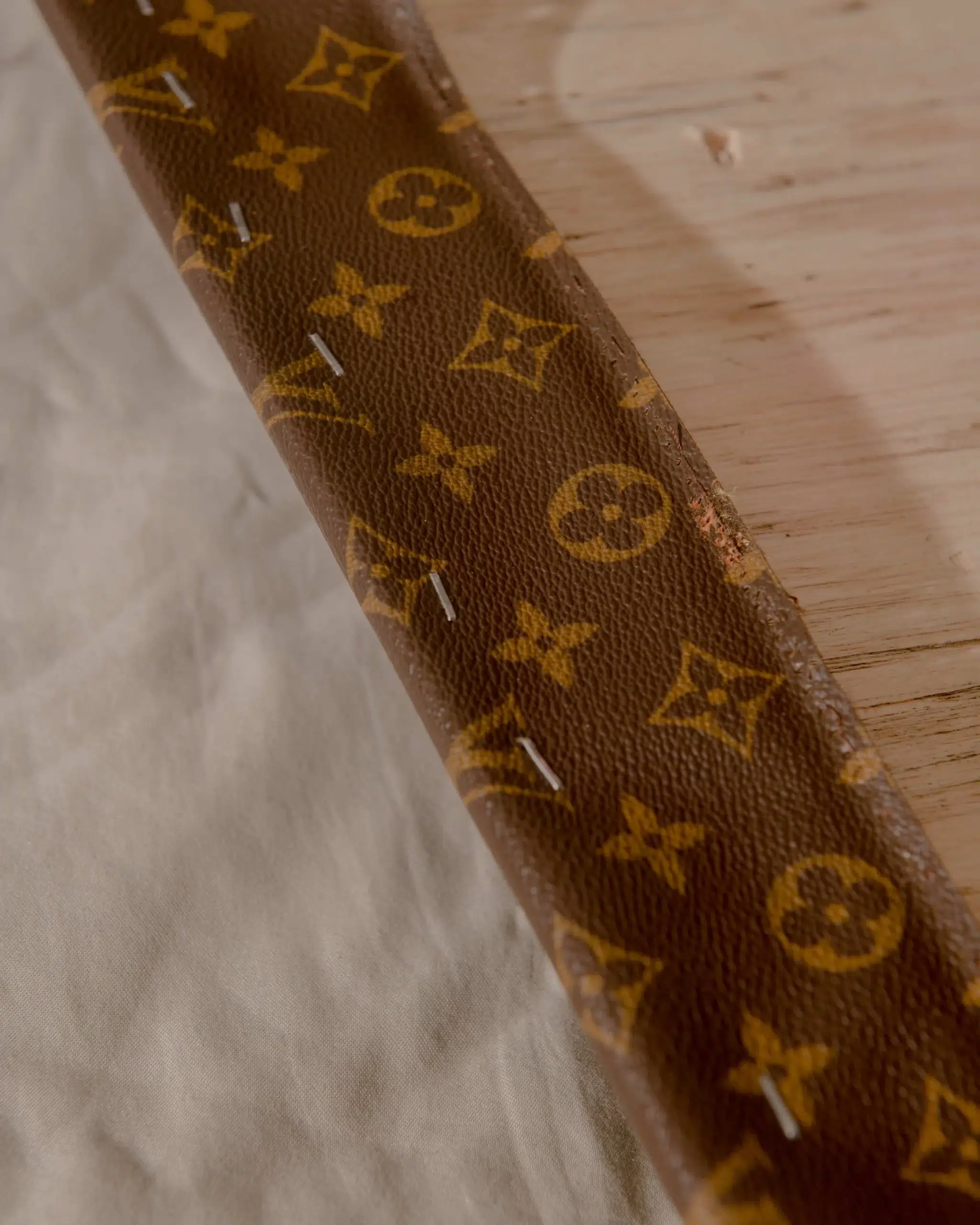 Monogram canvas strap with a Louis Vuitton Hoop.