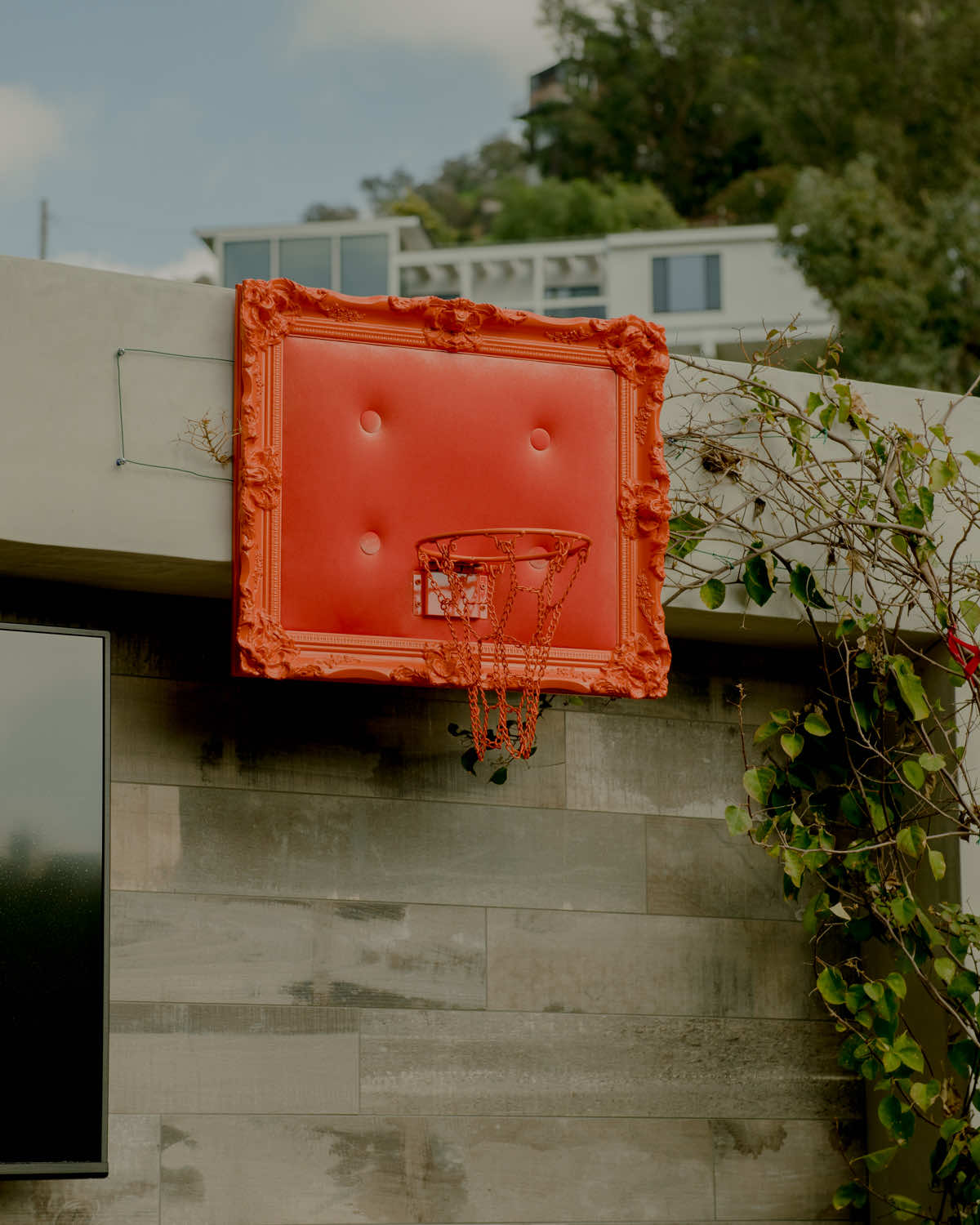 A basketball hoop on a wall.