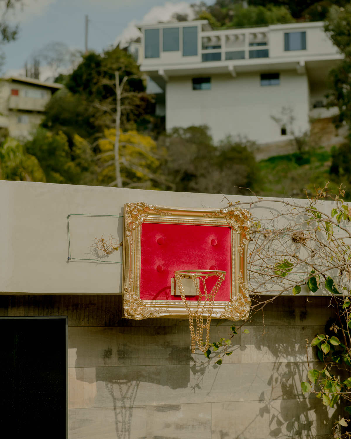 A basketball hoop with a red frame.