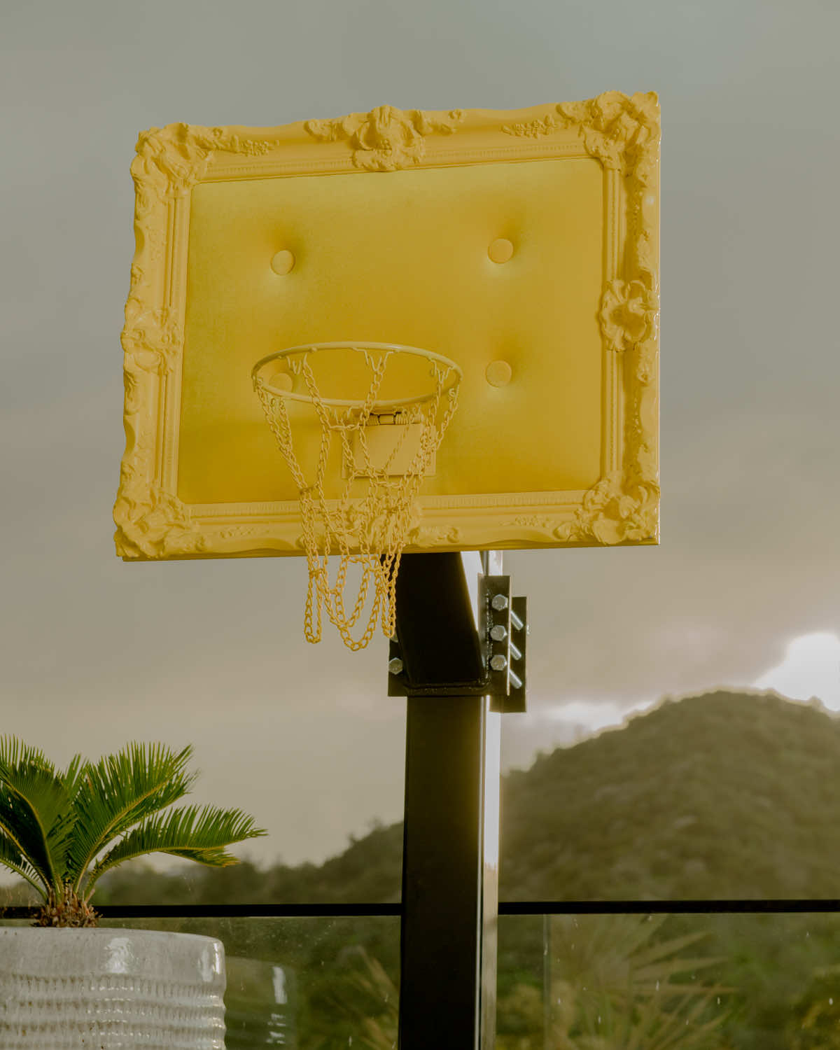 A basketball hoop with a yellow frame.