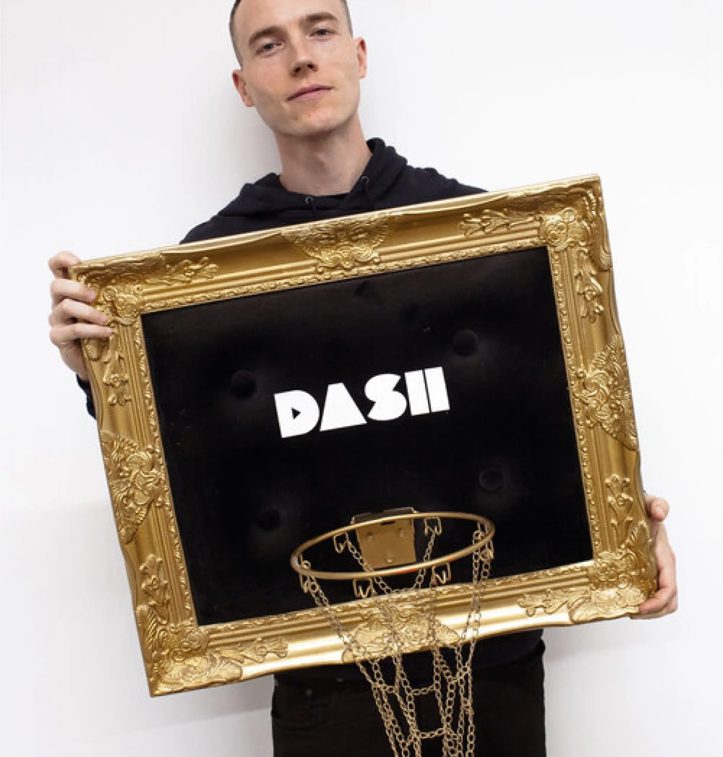 A man displaying a custom basketball hoop frame.