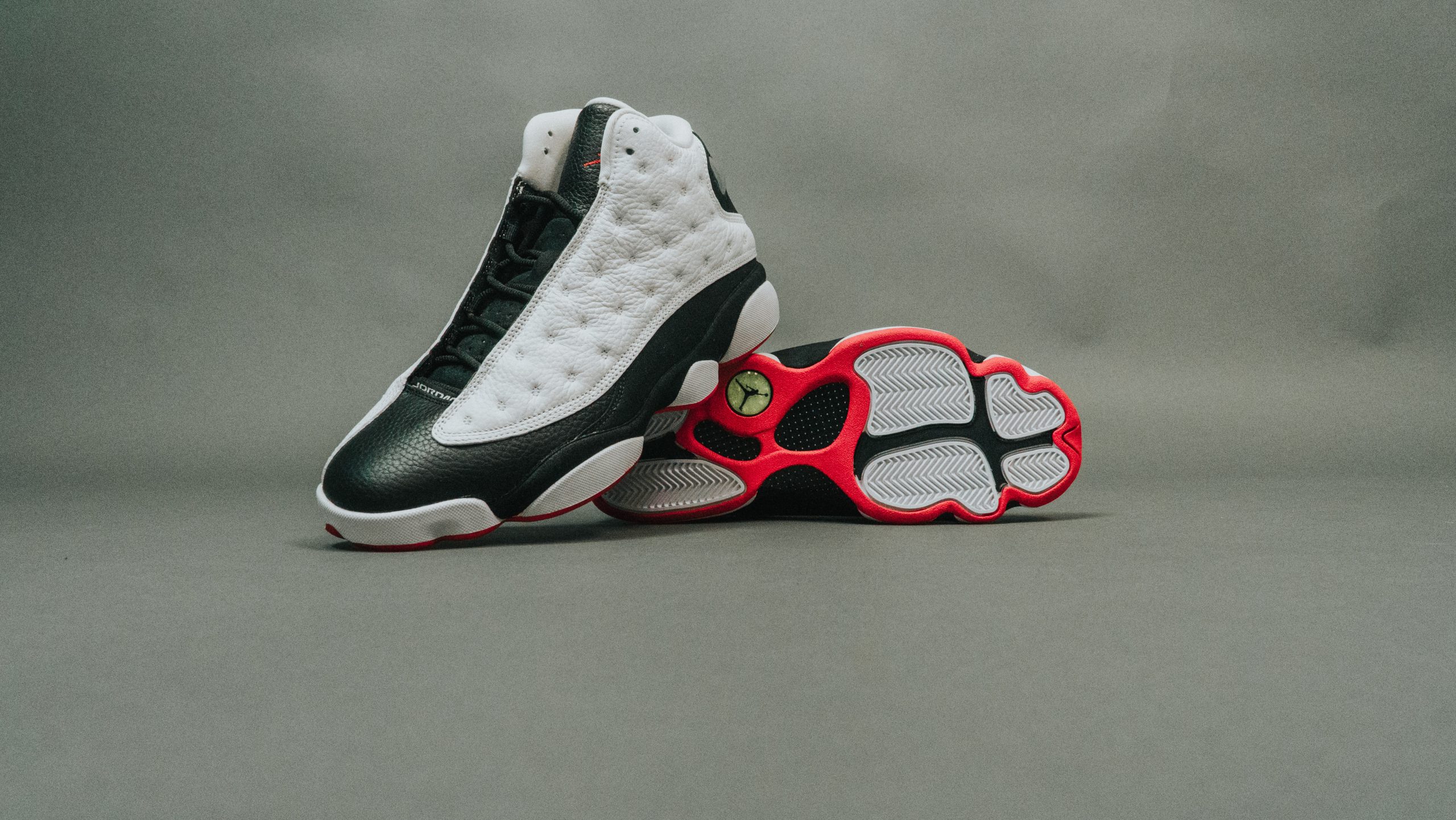 Nike Air Jordan 13 Retro: Classic white/black/red sneaker.